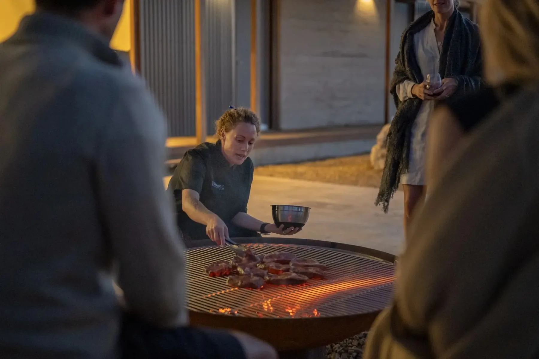A private chef cooking over fire at Immerse Kangaroo Island